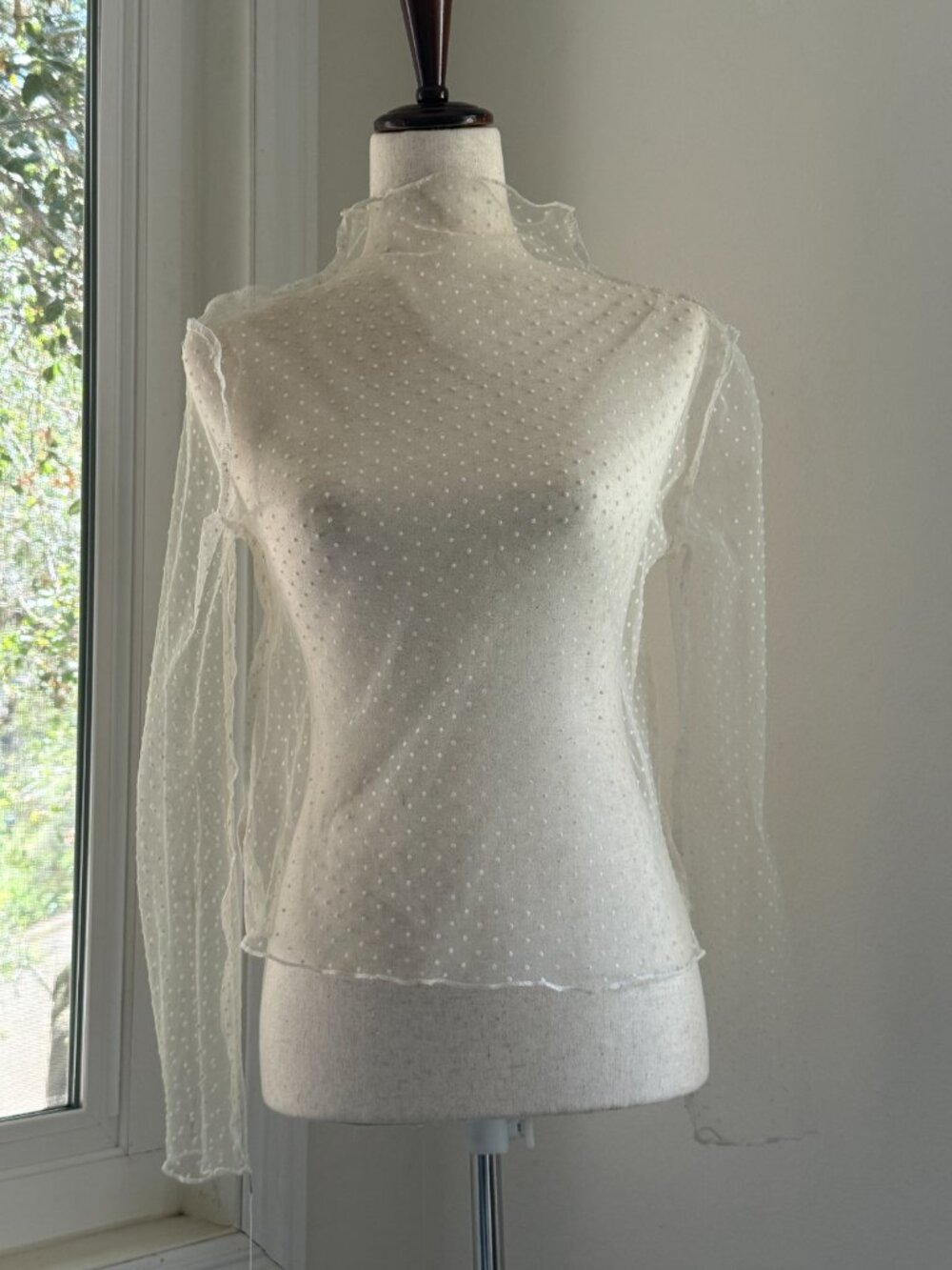 Long-sleeve sheer mesh top with polka-dot pattern